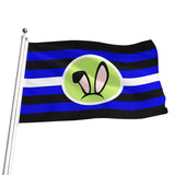 A bunny play flag on a silver pole with horizontal black and blue stripes, a white stripe, and a central oval containing a green bunny ear headband with pink inner ears.