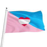 An ageplay-themed flag waving on a silver flagpole against a plain white background. The flag is divided diagonally with light blue on the top-right and light pink on the bottom-left, with a red and white heart centered in the middle.