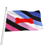A puppy play flag with diagonal stripes of blue, black, white, pink, and light blue, featuring a red bone in the center, shown waving on a silver flagpole against a white background.
