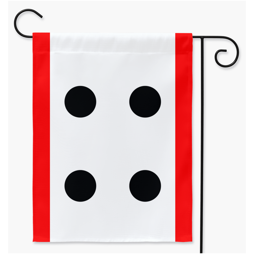 Mockup of a rectangular garden flag on a black metal flag stand. The flag has a narrow red stripe running vertically along the left and right edges. The centre is a white field with four black dots in teh centre. The dots are placed like the four corners of a square.